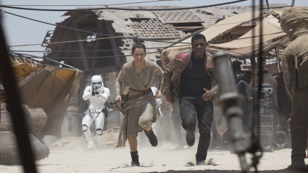 Rey (Daisy Ridley) and Finn (John Boyega) in <i>Star Wars: The Force Awakens</i>.