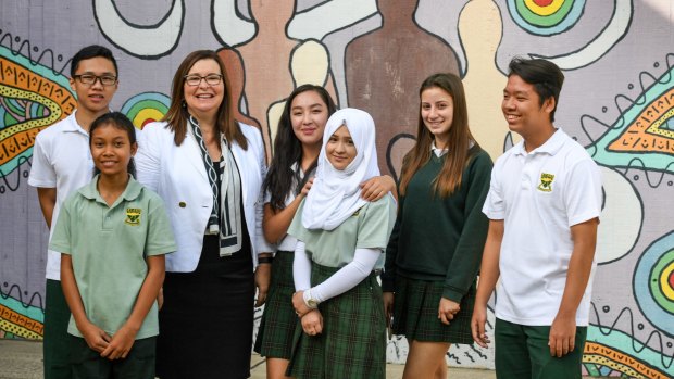 The diverse language population offers a wealth of benefits for teachers and students: (From left) Brandon Wu, Anchisa Loedpree, Principal Nerina Pretlove, Adinai Adigineeva, 17, Saima Babaie, Sibba Doumat, and Long Le, 16.