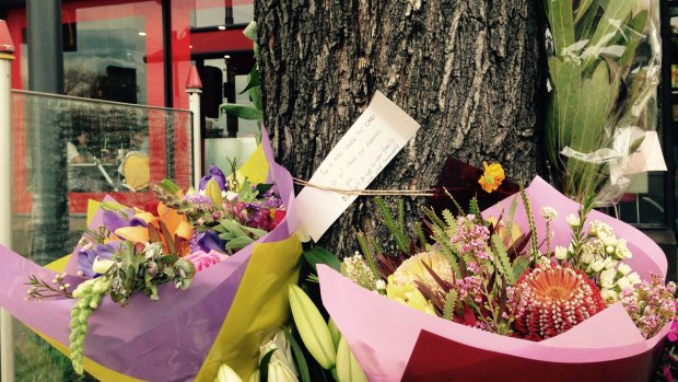 Flowers left at the scene of the attack on Joshua Hardy.