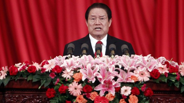 Then Politburo Standing Committee member Zhou Yongkang delivers a speech at a meeting in Beijing in 2012.