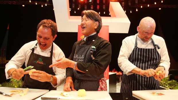 Queensland chefs Alastair McLeod (left) cheated halfway through his apple peeling race with Matt Golinski and whipped out a peeler.