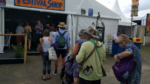 Woodfordians queue up to recharge their cashless tickets.