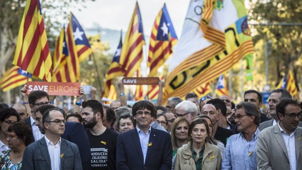 Carles Puigdemont, Catalonia's president, participates in a demonstration against the Spanish government.