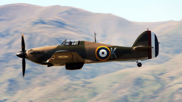 A WWII Hawker Hurricane fighter takes part in a mock battle during a Warbirds Over Wanaka airshow.