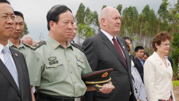 Governor General Peter Cosgrove paying respects at the Gull Forces war graves at Lao'ou, Hainan island in southern China, alongside People's Liberation Army general Liu Xin. 