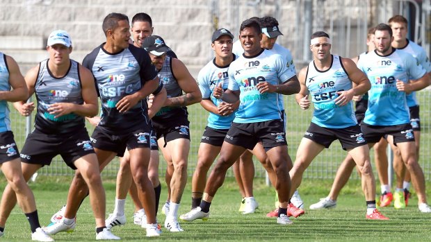 Stretching out: Sharks players warm up during a training session at Remondis Stadium on Monday.