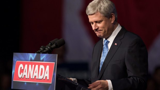 Conservative leader Stephen Harper pauses while addressing supporters after defeat in Calgary, Alberta, on Monday.