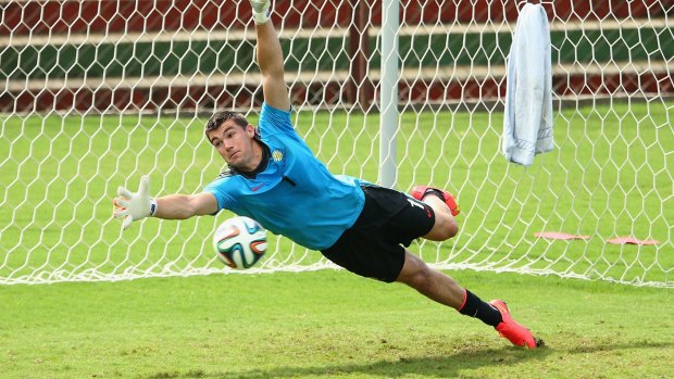 Hands up: Socceroos goalie Mat Ryan has mixed feelings about his first World Cup.