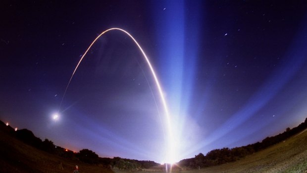 The path of a Delta rocket is shown in a time exposure as it lifts off from Cape Canaveral, Florida, carrying NASA's Mars Pathfinder probe.
