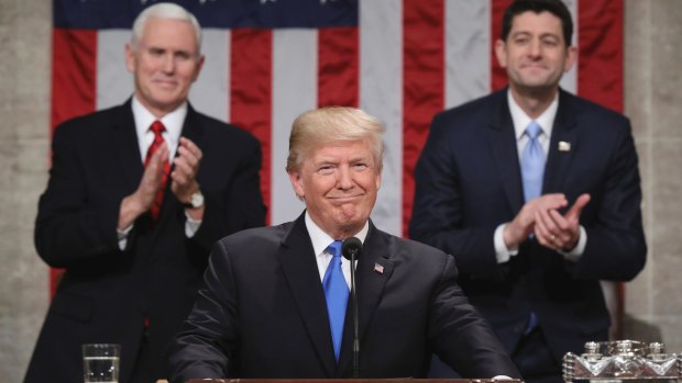 US President Donald Trump delivers his first State of the Union address on January 30 as Vice-President Mike Pence and House Speaker Paul Ryan applaud.  