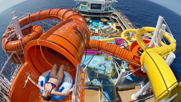 A guest onboard Carnival Vista slides down Kaleid-O-Slide.