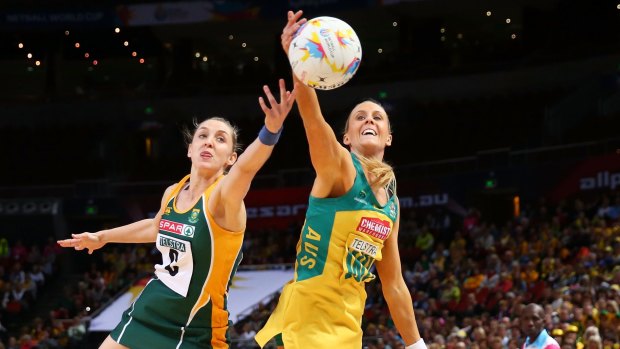 Australia's Renae Hallinan outstretches South Africa's Erin Burger for the ball in their world cup qualifying match on Wednesday night.