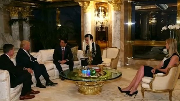 Japan PM Shinzo Abe, centre, meets with Donald Trump at Trump Tower on Friday, in the presence of Trump's daughter Ivanka.