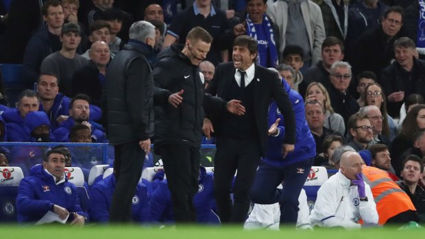 Fourth official Mike Jones breaks up Mourinho and Conte.