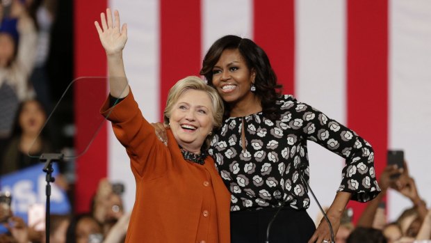 Hillary Clinton with first lady Michelle Obama at a rally in North Carolina.