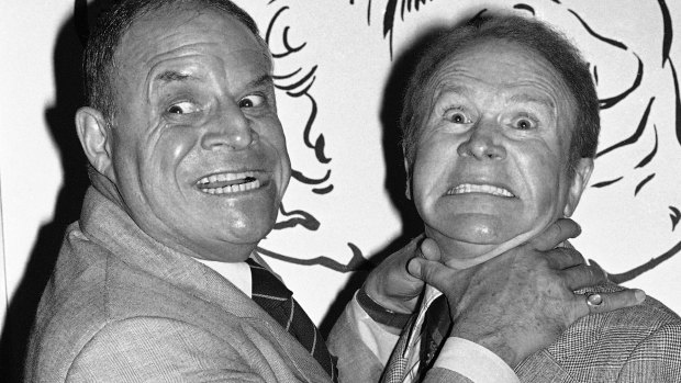 Don Rickles, left, pretends to strangle fellow comedian Red Buttons prior to an Annual Stag Roast in Los Angeles, 1977.