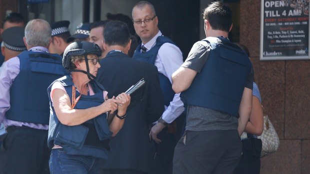 Police at the scene of the siege Monday afternoon.