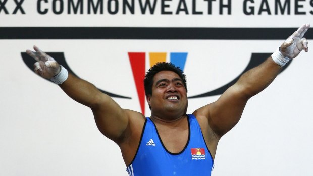 David Katoatau of Kiribati celebrates his nation's first gold medal.
