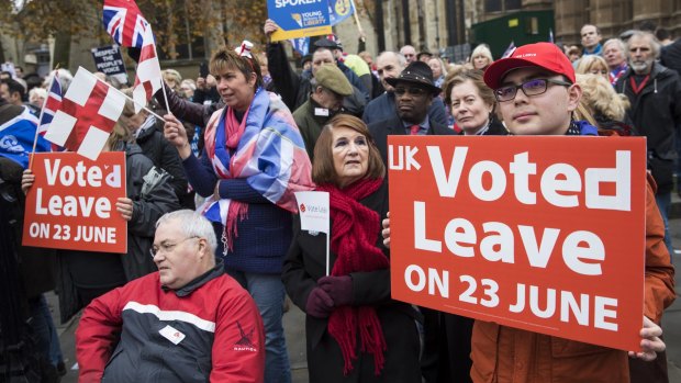 Pro-Brexit demonstrators outside the Houses of Parliament in London on Wednesday called for Prime Minister Theresa May to move forward with EU exit formalities.