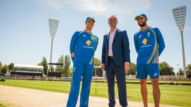 Andrew Barr, pictured with Steve Smith and Nathan Lyon, hopes to secure a regular Test in Canberra.