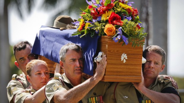 An Australian Army bearer party carries the coffin of the late Major General 'Digger' James during the funeral service.
