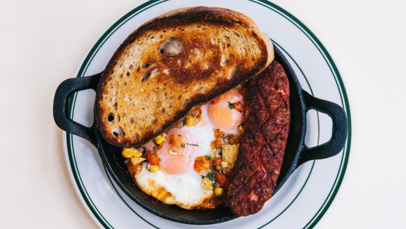 Spanish baked egg, 1904 baked beans, sausage, salsa and toast at Bodega 1904.