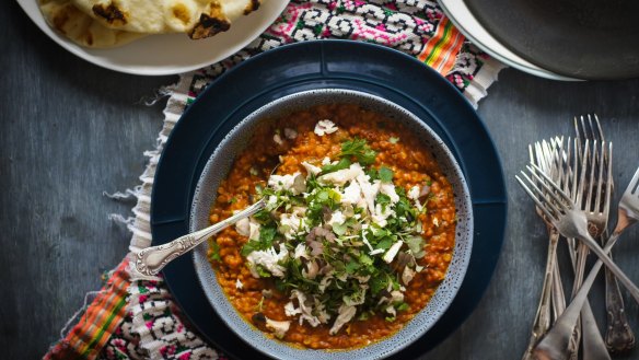 This butter chicken-inspired dhal can be made vegetarian - just swap the stock and hold the shredded chook (pictured as a topping).