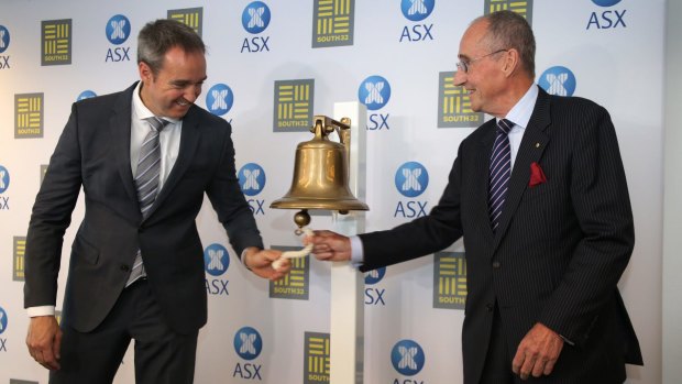 South32 CEO Graham Kerr and chairman David Crawford ring the bell at the Perth ASX. Net debt has improved since the group was floated in May this year. 