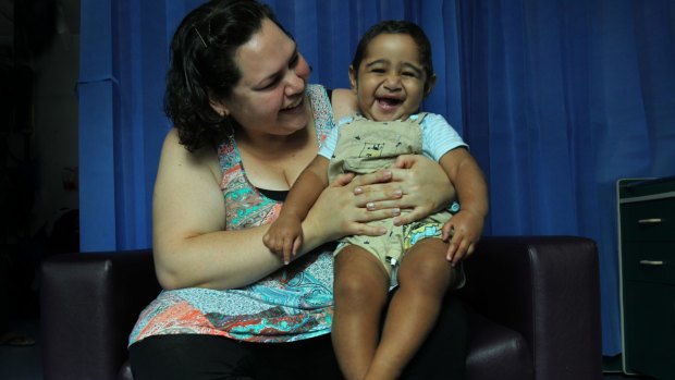 Melita Tawalo holds her son Kini, who received a life-saving bone marrow transplant.