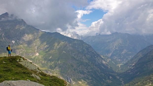 A hiker approaching Colle del Turlo, one of a string of high passes along the Tour de Monte Rosa.