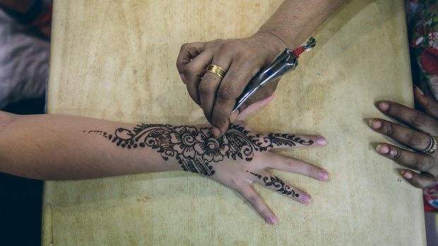 Henna tattoos.