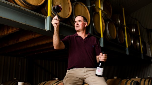 Clonakilla winemaker Tim Kirk with his Syrah wine. 
