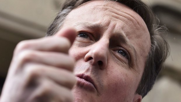 Prime Minister David Cameron speaks to locals while campaigning in Wetherby, West Yorkshire, in England. 