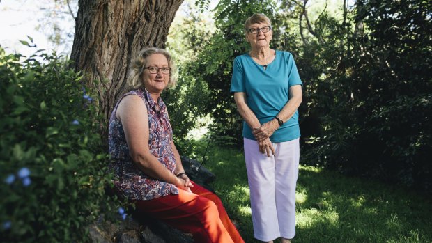 Mother and daughter, Thea Foster and Bronwyn Barnard in the backyard of the the family home under the Robina Pseudoacacia tree which inspired a memorial for those who lose their lives to illicit drugs.