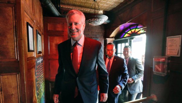 New York Mayor Bill de Blasio enters the Stonewall Inn after the dedication of the Stonewall National Monument on Monday. 