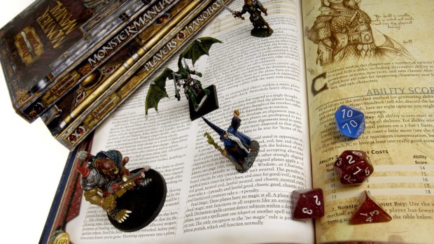 Books, die, figurines from Dungeons and Dragons.