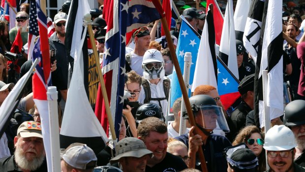 White nationalist demonstrators are surrounded by counter demonstrators in Charlottesville.