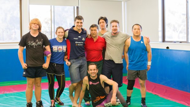 Canberra PCYC wrestling coach Witold Rejlich and athletes. The PCYC is celebrating its 60th birthday.