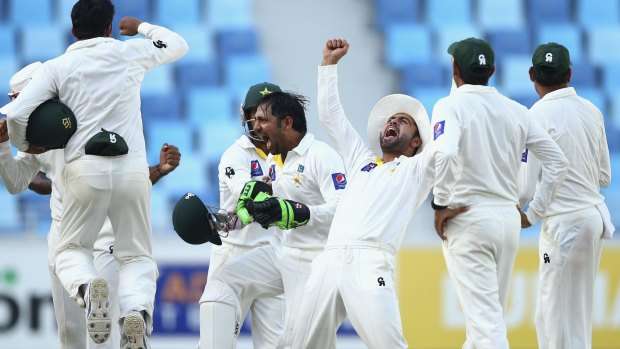 Sheer delight: Pakistan celebrate their crushing win over Australia in the first Test.