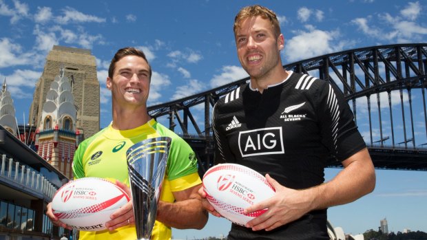 Team captains Ed Jenkins, Australia, and Tim Mikkelson, New Zealand, pose for a photograph for the World Rugby Sevens Series in front of the Sydney Harbour Bridge.