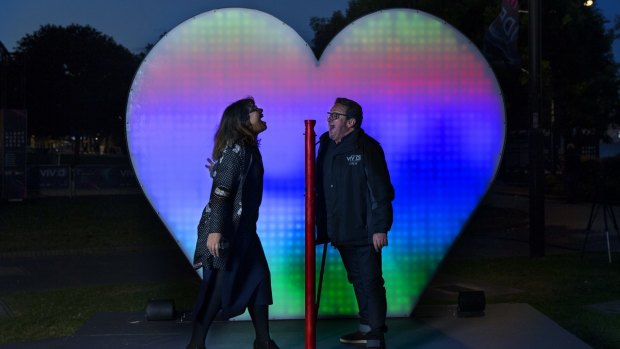 Jess Scully and Ignatius Jones try the "I Love You" installation at Circular Quay.  Vivid opens on Friday 27 May. 