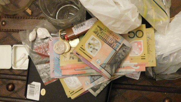 Police found money and heroin at the house.