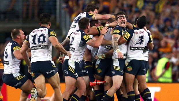 Greatest game of all: Cowboys players celebrate after Johnathan Thurston kicked the winning field goal in golden point extra time in the 2015 grand final.