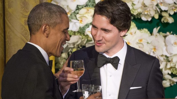 Canadian Prime Minister Justin Trudeau, right, proposes a toast to US President Barack Obama during the state dinner on Thursday.