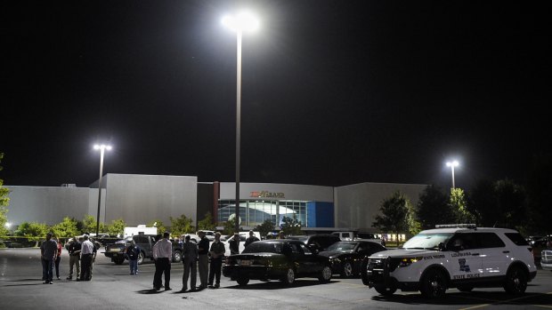 The parking lot outside the cinema. The investigation  was briefly halted when police found the gunman's vehicle and found what they said was a "suspicious package" inside.