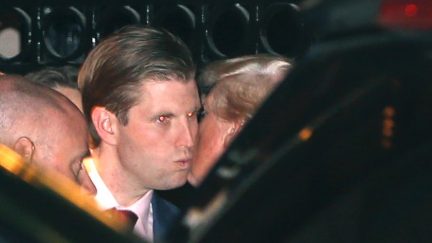 President-elect Donald Trump, right, kisses his son Eric farewell after dining at the 21 Club in New York on Tuesday.