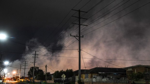 Acrid smoke shrouds the suburb of Dallas last week. More than 115 homes had to be evacuated.