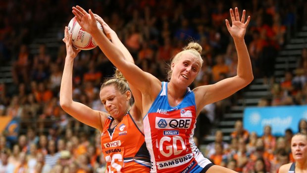 Super start: Jo Harten of the Giants and Maddy Turner of the Swifts contest possession.