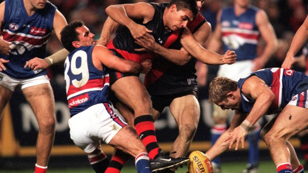 vjc000728.003.012

Pic Vince Caligiuri , The Age Melbourne

Western Bulldogs v Essendon , Colonial stadium...Tony Liberatore at his best with his fearsome tackling , this time he pins Essendons Dean Rioli

2000 AFL (Australian Football League) - Round 21- Essendon  versus  Western Bulldogs - Colonial Stadium