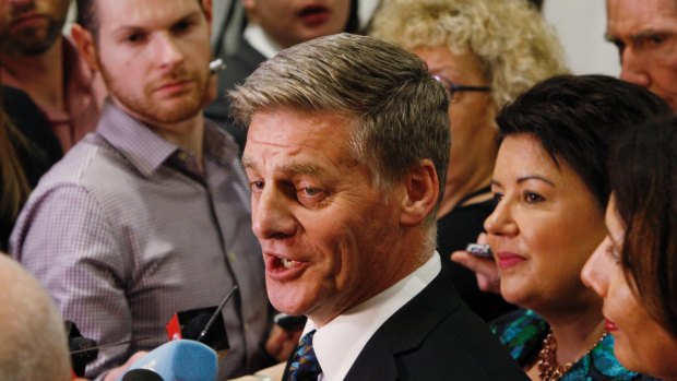 Outgoing Prime Minister Bill English talks to reporters on Thursday after learning Labour would form government.